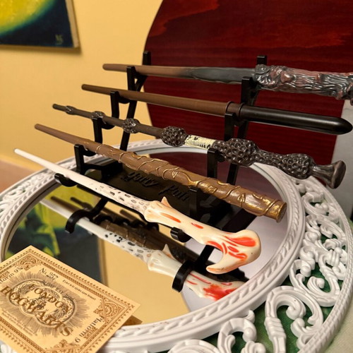 Harry Potter wand set of 5 like new with stand and gilded ticket