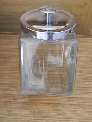 Glass polygon jar with stainless steel lid like new