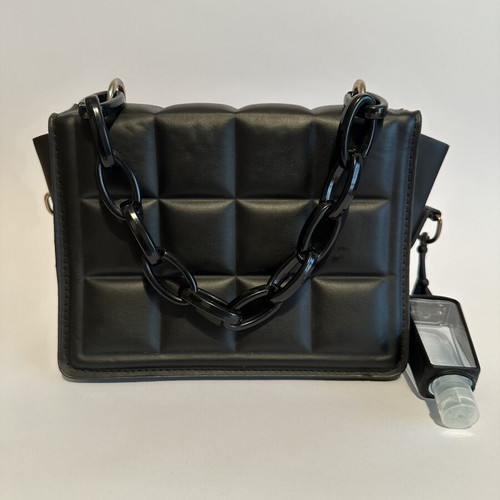 Leather handbag like new, black with shoulder strap and sanitizer bottle