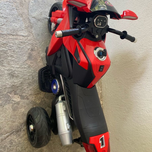 Electric children's motorcycle used with music