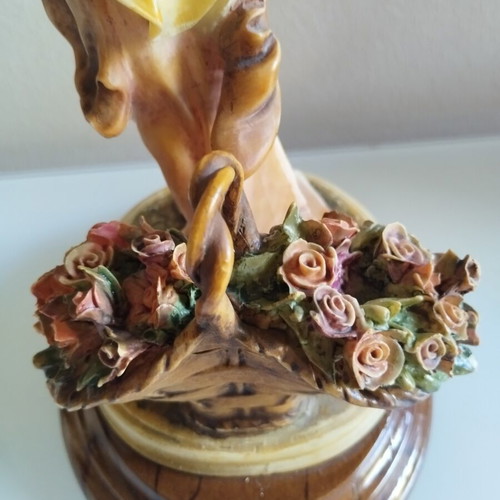 Vintage Italian decorative statue of a girl with roses, used