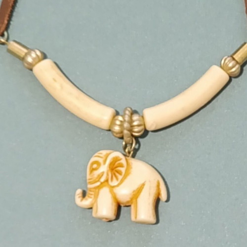 Ethnic necklace with brown leather cord and elephant pendant, vintage bakelite