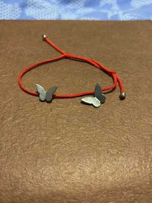Adjustable bracelet like new with silver details red