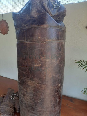 Antique leather boxing bag and gloves with Dublin college stamp