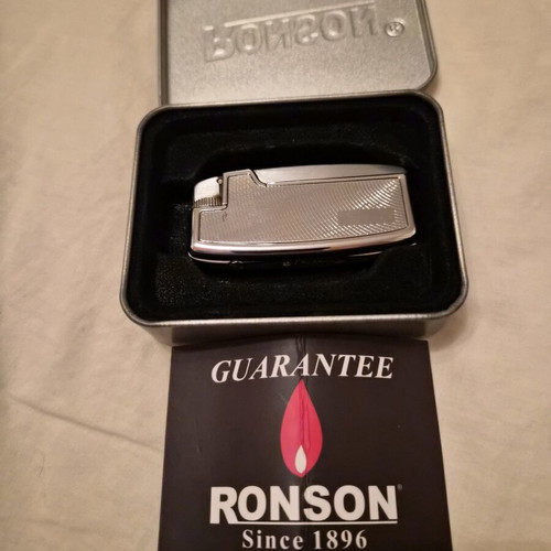 Ronson lighter like new with purchase tag