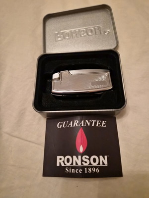 Ronson lighter like new with purchase tag