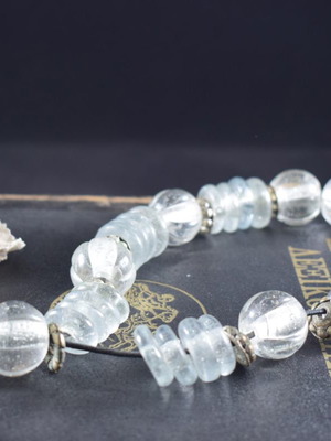 Decorative garland used with glass beads and metal elements