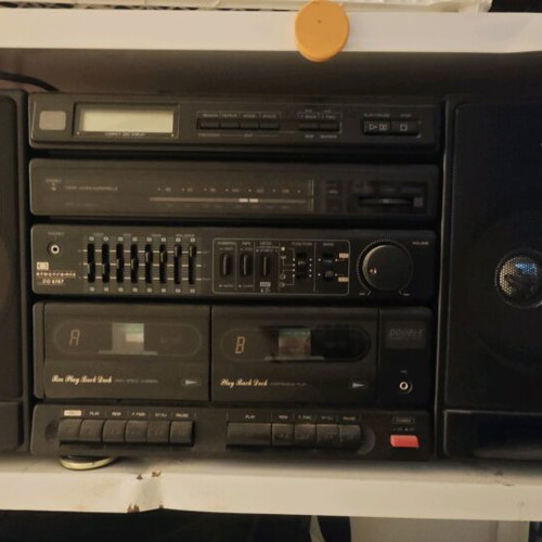 Booster stereo system used, 90s style, removable speakers