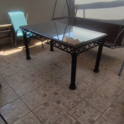 Table with solid iron base and solid teak wood top like new