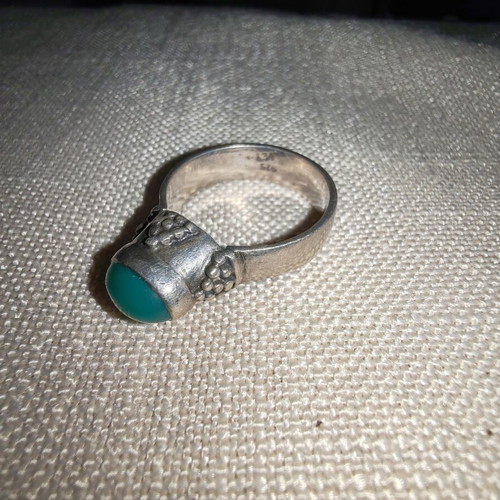 Silver ring with green stone used