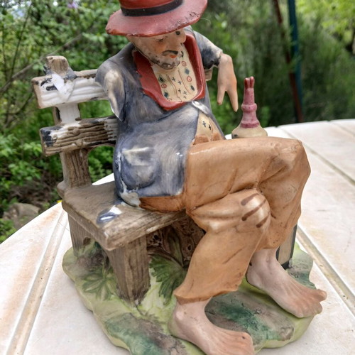 Traveler figurine used, missing one hand