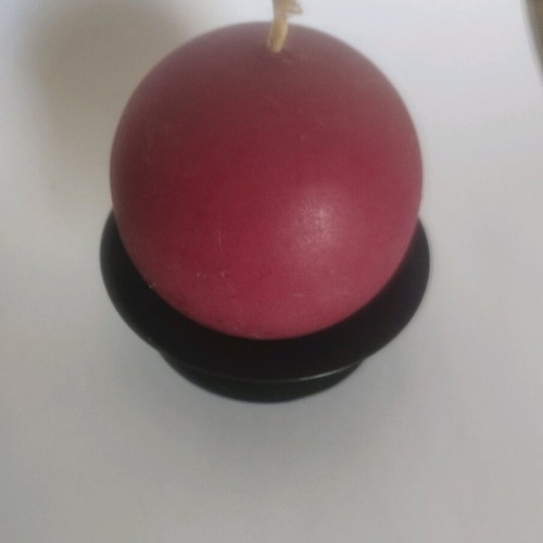 Round candle on metal black base like new