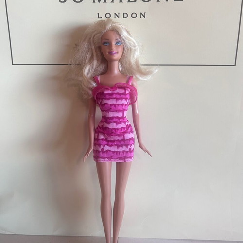 Mattel Barbie Beach doll with pink swimsuit and fuchsia dress
