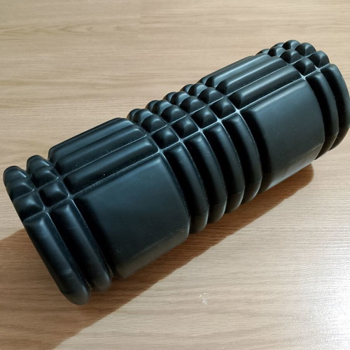 Foam roller like new with textured surface for massage and muscle recovery