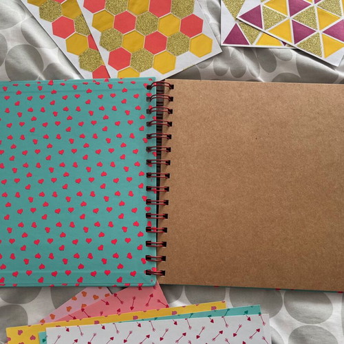 Scrapbooking kit used with stickers and decorative papers