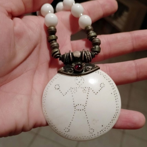 Handmade necklace with white pearls and bone charm used