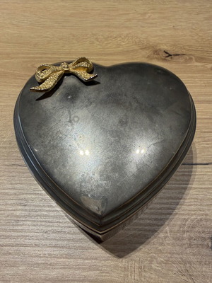 Vintage silver-plated heart-shaped jewelry and trinket box with gold-tone bow