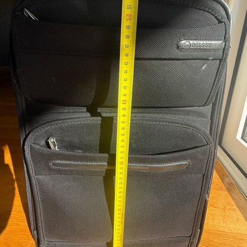 Delsey suitcase used with wheels small size black