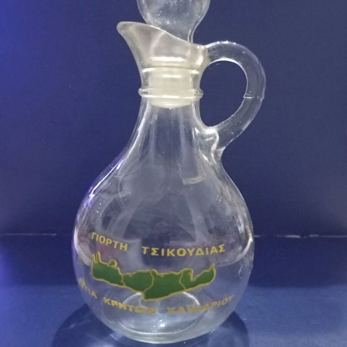 Glass bottle used from Tsikoudia festival Estia Kriton Haidariou