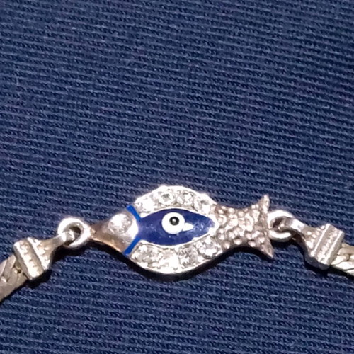 Silver 925 bracelet like new with blue eye and stones