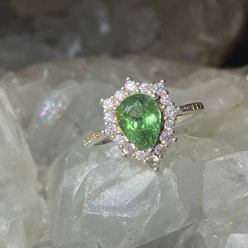 Silver ring with natural green tourmaline and moissanite