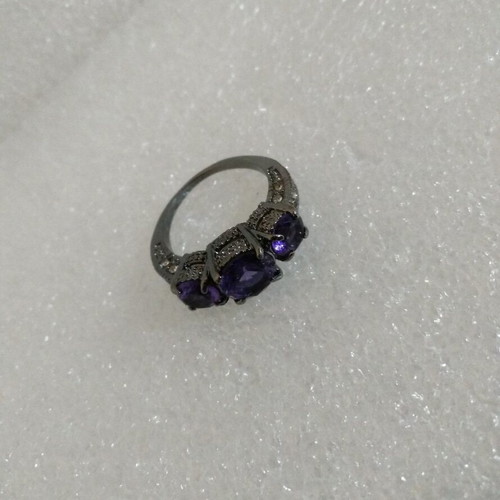 Ring with Purple Crystals and Black Plated Finish like new