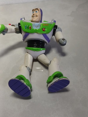Toy Story action figure used with wear
