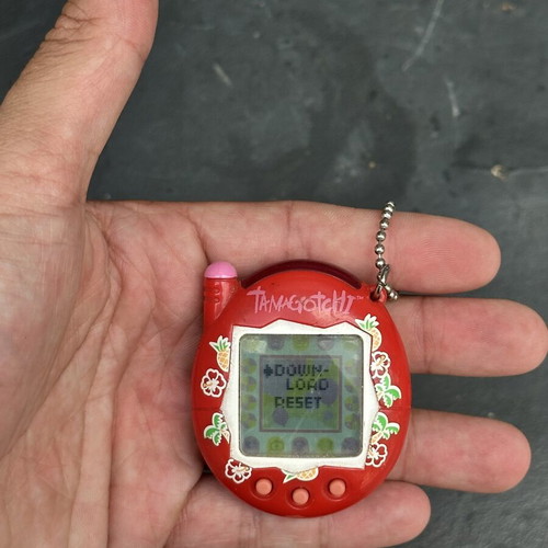 Vintage Tamagotchi Bandai 2004 red tropical design electronic keychain used