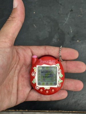 Vintage Tamagotchi Bandai 2004 red tropical design electronic keychain used