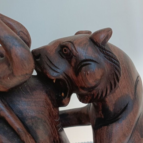 Hunting scene with buffalo and predators wood carving