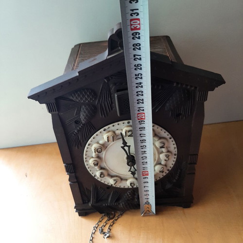 Vintage cuckoo clock used with pinecone weights