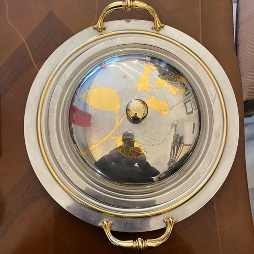 Serving dish made of steel with gold details like new