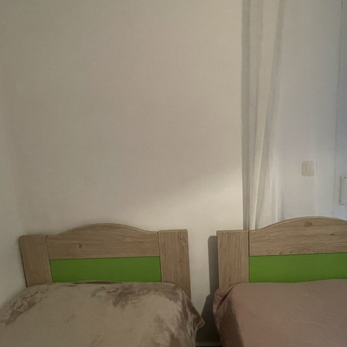 Wooden single beds with mattresses like new, set of 2