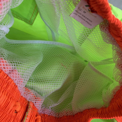Men's swim shorts like new, fluorescent green with orange details