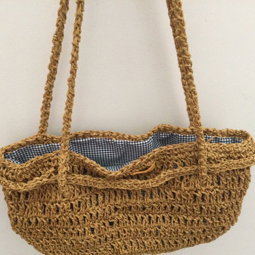 Knitted bag like new with golden yarn and fabric lining
