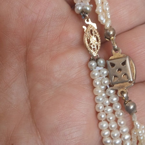 Two freshwater pearl necklaces with gold and metal clasps
