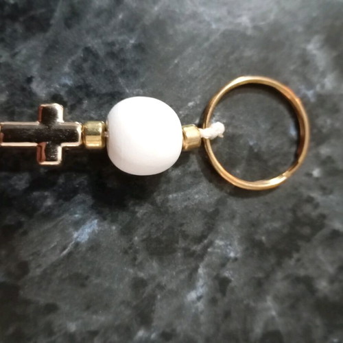 Handmade keychain, with a gold cross, Fuchsia tassel, white round wooden bead, new