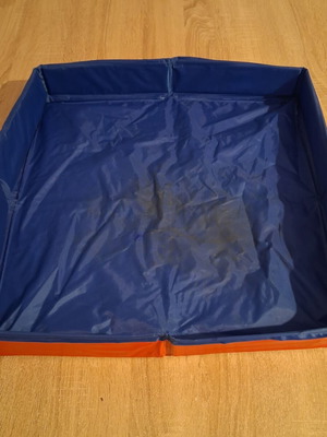 Collapsible sand and water play tray for kids, used