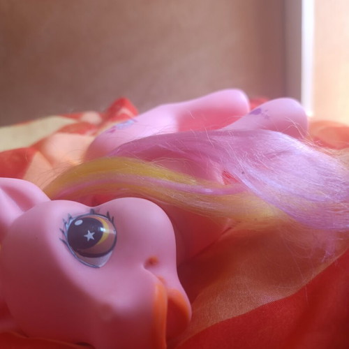 Large pink pony toy with colorful mane and tail
