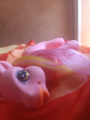 Large pink pony toy with colorful mane and tail