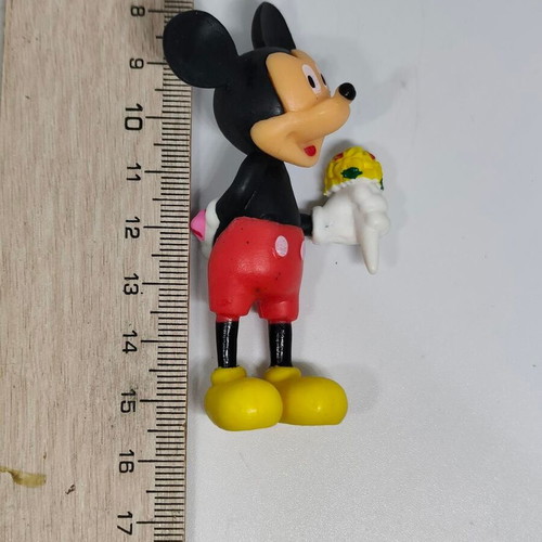 Collectible Mickey Mouse figure like new with bouquet