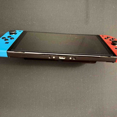 Nintendo Switch OLED used with carrying case and 256GB memory card