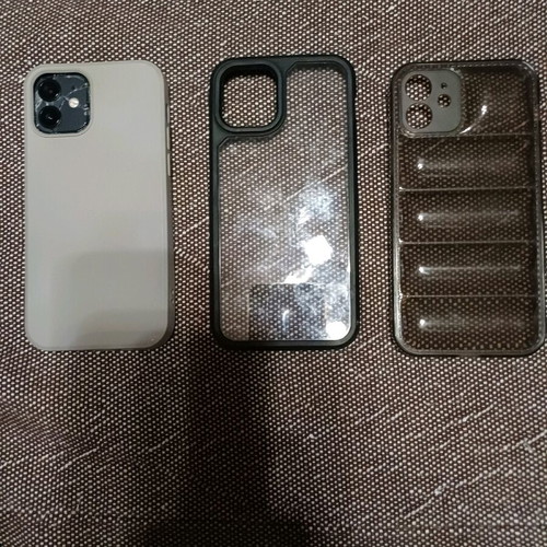 Apple iPhone 12 64GB like new with cracked back and 3 cases