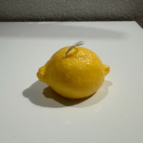Handmade lemon-shaped candle with lemon scent new