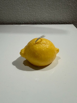 Handmade lemon-shaped candle with lemon scent new