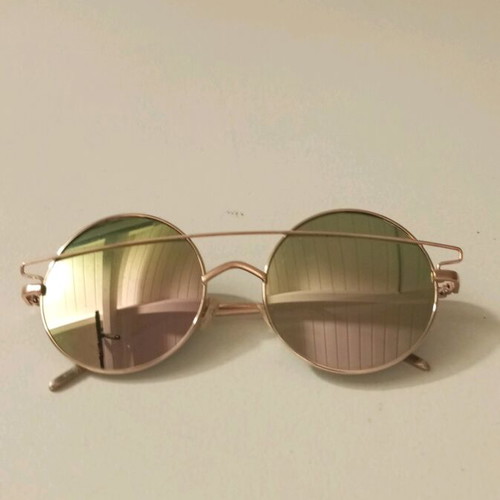 Sunglasses like new with rose gold frame and color-changing lenses