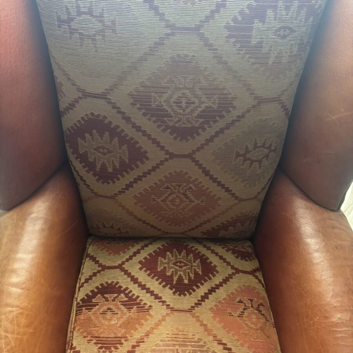 Kourtis armchair used with leather arms in brown tones