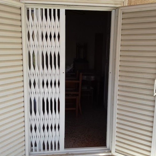 Aluminum balcony door used 116x198 with folding security grille