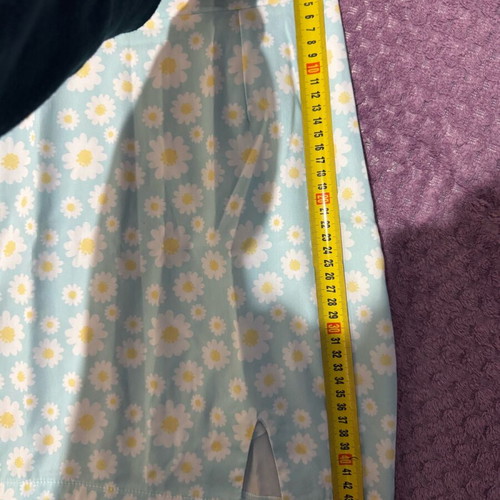 Mini skirt with daisies on blue background, size S, like new
