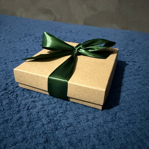 Decorative charm new, closed in its box